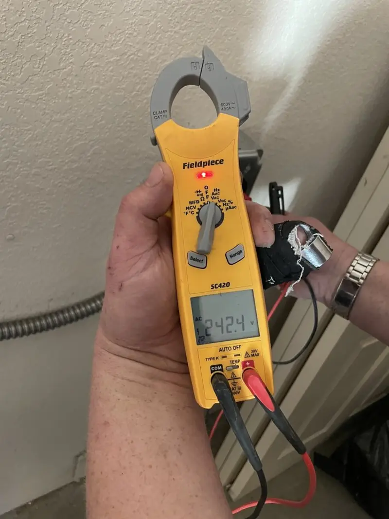 Voltage testing with clamp meter during Outlet Installation in Circle Pines